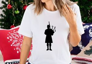 Silhouette of Bagpiper in Kilt