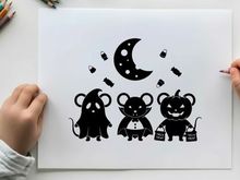 Halloween silhouette of three mice and a crescent moon
