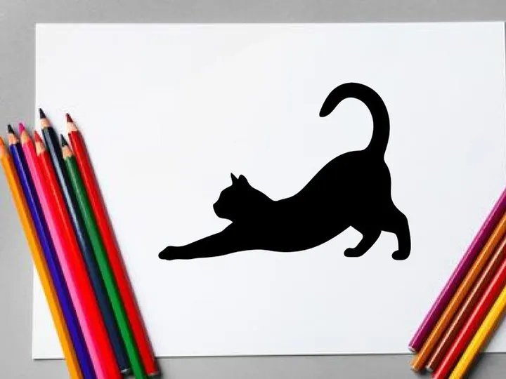 Silhouette of a playful black cat stretching on a white background