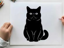 Silhouette of a black cat sitting and looking forward