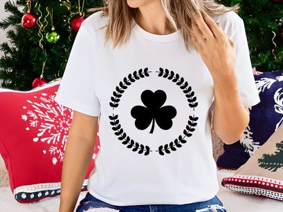 Black four leaf clover in laurel wreath vector luck symbol