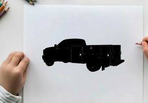 Silhouette of a large black truck with storage compartments