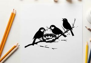 Silhouette of birds on a flowering branch with nest