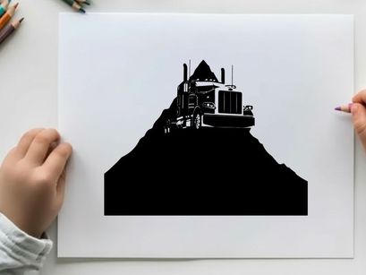 Silhouette of a semi truck on a hill