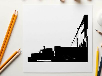 Silhouette of a semi truck parked beside a large building