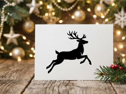 Black silhouette of a jumping reindeer isolated on a white background for Christmas design