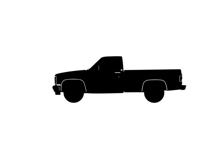 Silhouette of a classic pickup truck against a white background