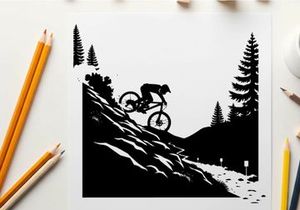 Mountain biker in silhouette on snowy forest trail downhill