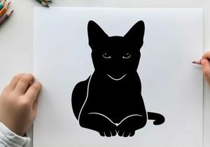 Black silhouette of a cat sitting down looking forward