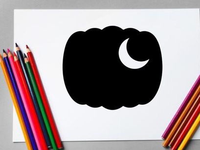 Silhouette of a pumpkin with a crescent moon in the night sky