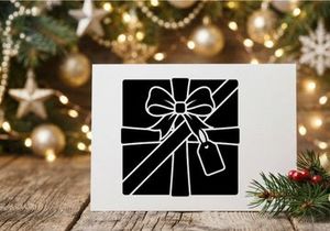 Black and White Gift Box with Ribbon and Tag for Christmas or Holiday
