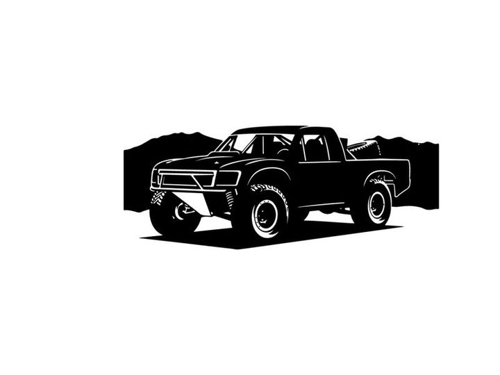 Silhouette of a pickup truck in front of mountains