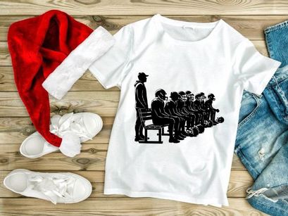 A group of people sitting in a line with one standing beside them