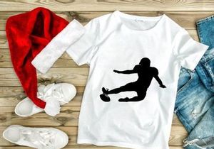 Rugby player kicking ball in mid action dynamic movement