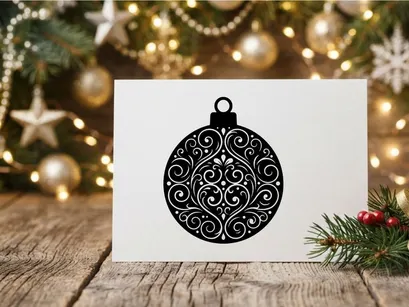 Silhueta de enfeite de Natal preto com padrão intrincado de espirais florais em fundo branco
