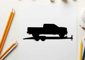 Silhouette of a pickup truck on a trailer