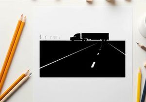 Silhouette of a semi truck driving down a highway at night