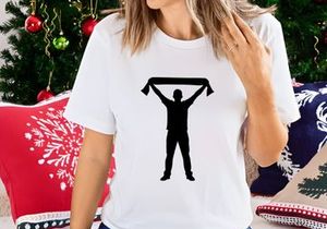 A person holding up a scarf in the air with both hands