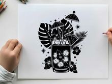 Tropical silhouette of a refreshing cocktail with umbrella and leaves