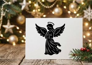 Black silhouette of a praying angel with wings and halo isolated on a white background