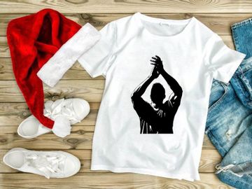 A silhouette of a man throwing a ball with both hands up in the air preview picture