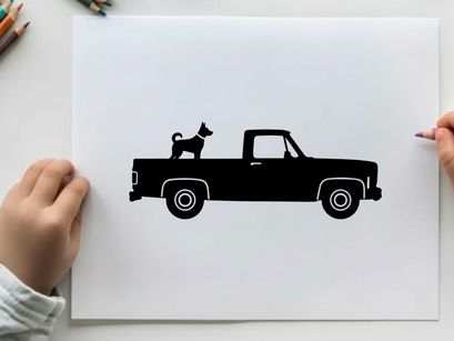 Silhouette of a dog riding in the back of a pickup truck