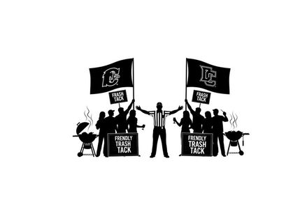 Silhouette of people holding michigan tech flags and grilling