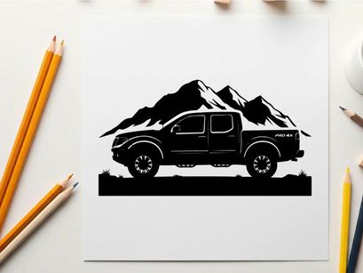 Silhouette of a pickup truck in front of mountains