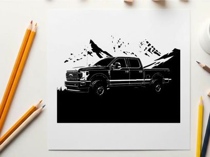 Silhouette of a pickup truck against a mountain range silhouette