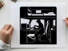 Silhouette of a man working on laptop inside a camper van