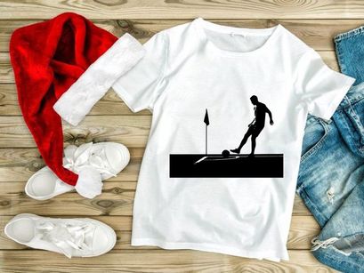 Silhouette of a soccer player kicking a ball near a corner flag on a field