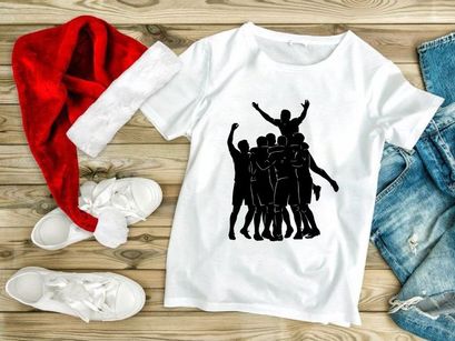 A group of people celebrating with one person lifted up in triumph