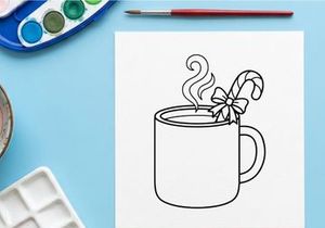 Hot cocoa mug with candy cane and snowflake steam for festive Christmas celebration