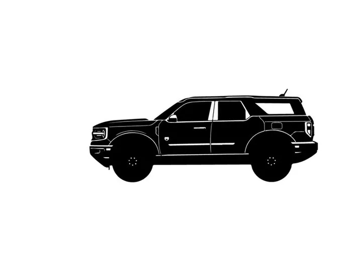Silhouette of a large black suv with a boxy design