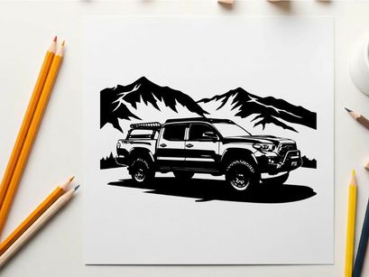 Silhouette of a rugged pickup truck in front of majestic mountains