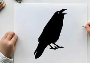 Silhouette of a black bird with open beak on white background