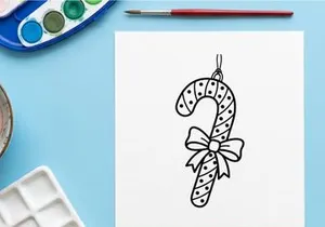 Christmas candy cane ornament line art illustration with a decorative bow for coloring page