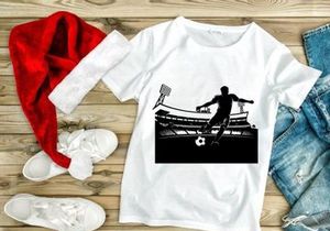 Soccer player kicking a ball in a stadium
