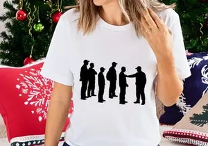 Silhouette of a line of people with one person reaching out to another