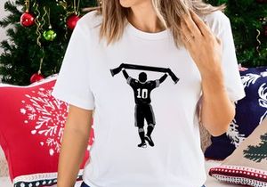 Silhouette of a sports player celebrating with a scarf