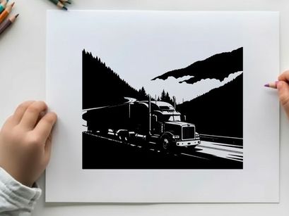 Truck driving through mountains in silhouette