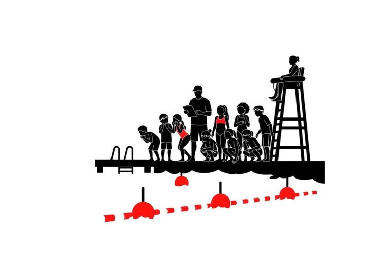 Silhouette of people on a dock with a lifeguard in a tower