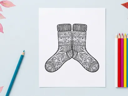 Pair of cozy knitted Christmas socks with snowflake patterns for festive holiday gifting