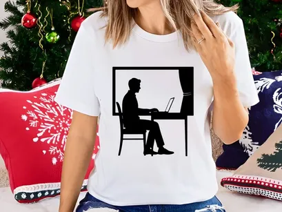 Freelancer working on laptop by sunny window at home office