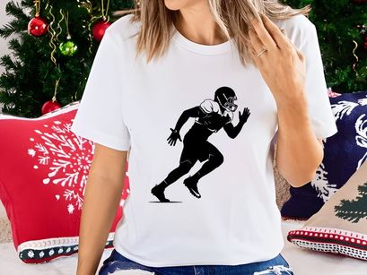 American football player in motion running with helmet and pads