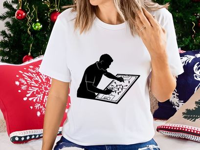 Man studying a large map or blueprint with focus and concentration