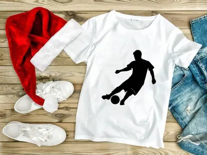 Soccer player kicking a ball in dynamic motion on the field