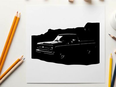 Silhouette of a classic pickup truck in front of mountains