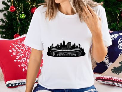 Black and white illustration of a city skyline with a large stadium