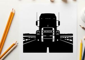 Silhouette of a mack truck on a bridge